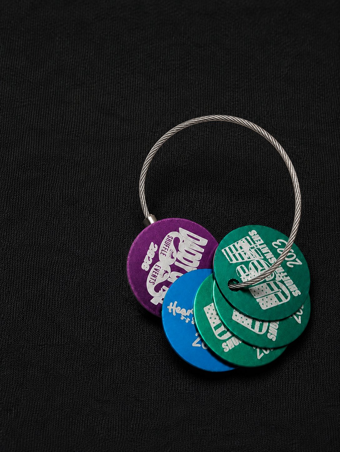 Actual round SkateTagz on a cable ring